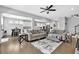 Open living area with hardwood floors, comfortable seating, and a view of the dining room at 4445 Hager Ct, Cumming, GA 30040