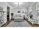 Bright living room featuring stylish decor, modern lighting, and large windows at 4445 Hager Ct, Cumming, GA 30040