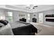 Large main bedroom with neutral carpet, a ceiling fan, and ample natural light at 4445 Hager Ct, Cumming, GA 30040