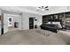 Spacious main bedroom with wood accent wall, ceiling fan and neutral carpet at 4445 Hager Ct, Cumming, GA 30040