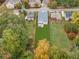 A high aerial view showcasing the home's large backyard, mature trees, and neighborhood surroundings at 474 Haley Se St, Marietta, GA 30060