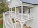 Covered back porch with a ceiling fan and stairs leading to the backyard at 474 Haley Se St, Marietta, GA 30060