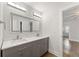 Bathroom boasts double vanity with sleek countertops, modern lighting, and neutral paint at 474 Haley Se St, Marietta, GA 30060