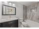 Bathroom featuring sleek vanity, and tiled shower/tub with modern fixtures, bright overhead lighting at 474 Haley Se St, Marietta, GA 30060