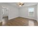 Bright bedroom with hardwood floors, a ceiling fan, and a walk-in closet at 474 Haley Se St, Marietta, GA 30060