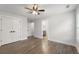 Spacious bedroom with hardwood floors, a ceiling fan, and ample closet space at 474 Haley Se St, Marietta, GA 30060