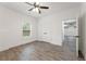 Well-lit bedroom featuring light colored walls, natural light, double door closet, and luxury vinyl floors at 474 Haley Se St, Marietta, GA 30060
