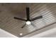 Close-up of a modern ceiling fan with wooden ceiling accents and recessed lights at 474 Haley Se St, Marietta, GA 30060