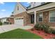 Beautiful two-story home featuring a stone and white shingle facade with well-manicured front yard at 474 Haley Se St, Marietta, GA 30060