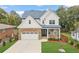 Beautiful two-story home with stone accents, a manicured lawn, and a two-car garage at 474 Haley Se St, Marietta, GA 30060