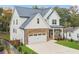 Charming home with stone accents, a two-car garage, and a well-maintained front lawn at 474 Haley Se St, Marietta, GA 30060