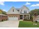 Attractive two-story home with stone accents, a two-car garage, and a well-kept front yard at 474 Haley Se St, Marietta, GA 30060