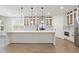 Bright kitchen with a large island, stainless steel appliances, and modern pendant lights at 474 Haley Se St, Marietta, GA 30060