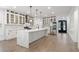 Open kitchen featuring quartz countertops, stainless appliances, and hardwood flooring at 474 Haley Se St, Marietta, GA 30060