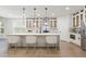 Open kitchen with white cabinets, a large island, and contemporary pendant lighting at 474 Haley Se St, Marietta, GA 30060