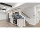 Open-concept kitchenette featuring stainless steel appliances, white cabinets, and modern backsplash at 474 Haley Se St, Marietta, GA 30060