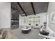 Open-concept living room featuring high ceilings with dark wood beams and modern fireplace at 474 Haley Se St, Marietta, GA 30060