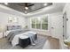 Bright and airy main bedroom with tray ceiling, a large window, and neutral decor at 474 Haley Se St, Marietta, GA 30060