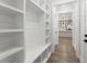 Bright mudroom features built-in storage, shelving, and bench seating with easy access to the kitchen at 474 Haley Se St, Marietta, GA 30060