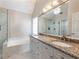 Luxurious bathroom with double vanity, granite countertop, and separate glass shower at 2348 Logan Ne Cir, Brookhaven, GA 30319