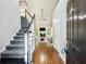 Inviting foyer with hardwood floors, stairway, and view into the bright living room at 2348 Logan Ne Cir, Brookhaven, GA 30319