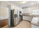 Modern kitchen with stainless steel appliances, granite countertops, and ample cabinet space at 2348 Logan Ne Cir, Brookhaven, GA 30319