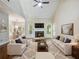 Spacious living room features a fireplace, vaulted ceiling, and large windows at 2348 Logan Ne Cir, Brookhaven, GA 30319