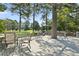 Back deck is an excellent outdoor space with seating, grill, and views of the backyard and mature trees at 3011 Stillwater Dr, Villa Rica, GA 30180