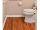 Bathroom with toilet and hardwood floors at 3011 Stillwater Dr, Villa Rica, GA 30180