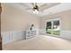 Bedroom with white wall trim, bright window, and neutral carpet at 3011 Stillwater Dr, Villa Rica, GA 30180