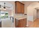 Butler pantry has oak cabinets and stone countertops at 3011 Stillwater Dr, Villa Rica, GA 30180