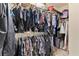 Organized walk-in closet with clothing and shelving at 3011 Stillwater Dr, Villa Rica, GA 30180