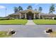 Spacious clubhouse featuring an arched entryway, stately columns, and lush green landscaping at 3011 Stillwater Dr, Villa Rica, GA 30180