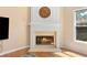 Living room fireplace features an ornate mantle and adjacent window at 3011 Stillwater Dr, Villa Rica, GA 30180