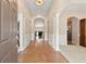 Inviting foyer featuring hardwood floors and arched doorways leading to living spaces at 3011 Stillwater Dr, Villa Rica, GA 30180