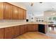 Kitchen has stone countertops, wood cabinets and hardwood floors at 3011 Stillwater Dr, Villa Rica, GA 30180