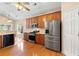 Kitchen features stainless appliances and oak cabinets and view to breakfast area at 3011 Stillwater Dr, Villa Rica, GA 30180