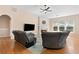 Cozy living room boasting hardwood floors, fireplace, and ample natural light at 3011 Stillwater Dr, Villa Rica, GA 30180