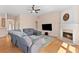 Spacious living room features hardwood floors, fireplace, and ceiling fan at 3011 Stillwater Dr, Villa Rica, GA 30180