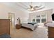 Spacious bedroom with a trey ceiling, a ceiling fan, and a large window at 3011 Stillwater Dr, Villa Rica, GA 30180
