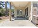 Covered patio features stone flooring, grill, and outdoor seating, perfect for relaxing or entertaining outdoors at 3011 Stillwater Dr, Villa Rica, GA 30180
