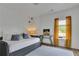 Cozy bedroom with a daybed, natural light, and decorative art at 5985 Hidden Ridge Ct, Cumming, GA 30028