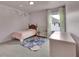 Cozy bedroom with a comfortable bed and a soft, floral patterned rug at 5985 Hidden Ridge Ct, Cumming, GA 30028