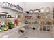 Spacious walk-in pantry with ample shelving for storage and organization at 5985 Hidden Ridge Ct, Cumming, GA 30028