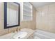 Bathroom with tile shower, granite counters and built-in shelving at 1260 White Oak Se St, Conyers, GA 30013