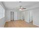 Bedroom with new flooring, fan, closet and multiple doorways at 1260 White Oak Se St, Conyers, GA 30013