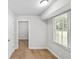 Cozy bedroom featuring wood-look floors and a large window at 1260 White Oak Se St, Conyers, GA 30013
