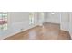 Bright living room with light wood floors and white wainscoting offers a clean, inviting space at 1260 White Oak Se St, Conyers, GA 30013