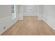 Bright living room with light wood floors and white wainscoting offers a clean, inviting space at 1260 White Oak Se St, Conyers, GA 30013