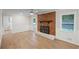 Living room with brick fireplace, wood floors, and a view to the backyard at 1260 White Oak Se St, Conyers, GA 30013